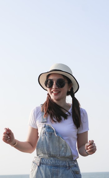 Woman Wearing White Shirt and Sun Hat