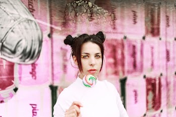 Woman Wearing White Shirt Holding Lollipop