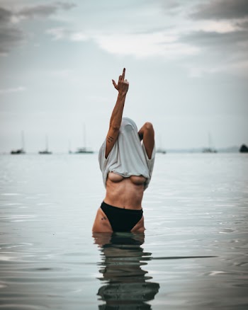 Woman Wearing White Shirt Raise His Middle Finger