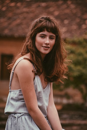 Woman Wearing White Sleeveless Dress