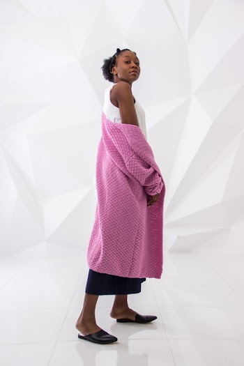 Woman Wearing White Sleeveless Dress and Pink Long Coa
