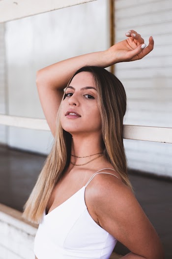 Woman Wearing White Sleeveless Top