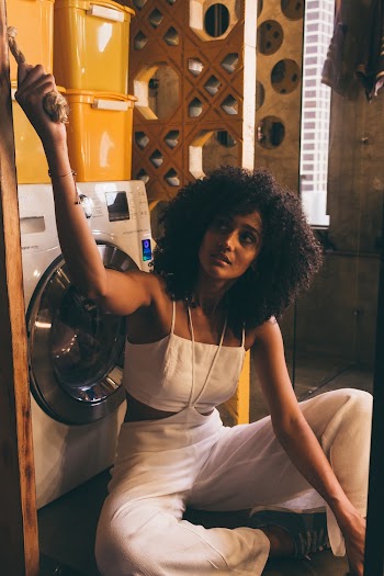 Woman Wearing White Spaghetti Strap Crop Top With White Pants