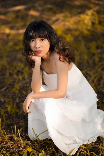Woman Wearing White Spaghetti Strap Dress