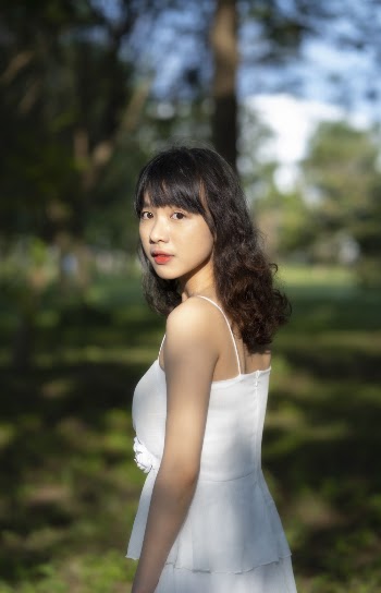 Woman Wearing White Spaghetti Strap Dress