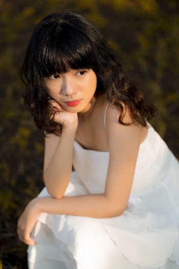Woman Wearing White Spaghetti Strap Dress