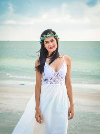 Woman Wearing White Spaghetti Strap Dress Standing on Seashore Under Clear Blue Sky