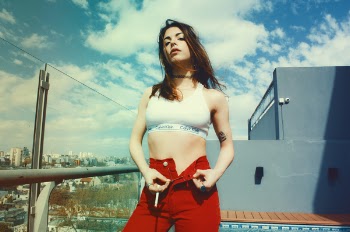 Woman Wearing White Sports Bra And Red Bottoms 