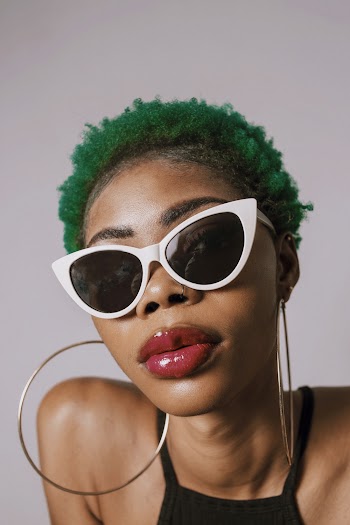 Woman Wearing White Sunglasses and Hoop Earrings