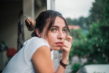 Woman Wearing White T-shirt Facing Her Right Side