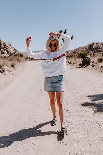 woman wearing white Tommy Hilfiger long-sleeved shirt