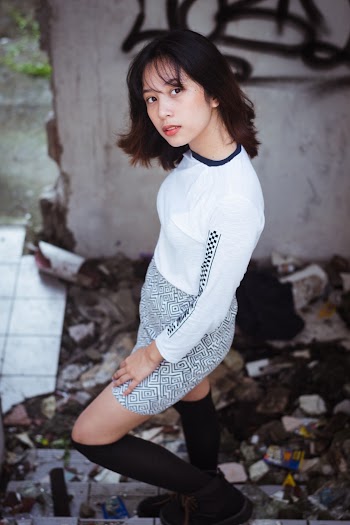 Woman Wearing White Top and Skirt