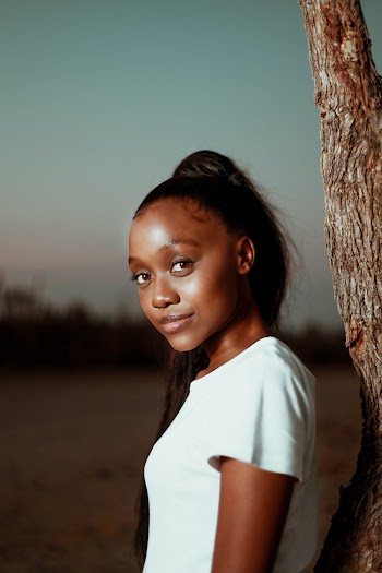 Woman Wearing White Top Beside Tree