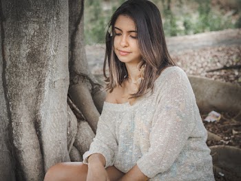 Woman Wearing White Top Sitting Beside Tree
