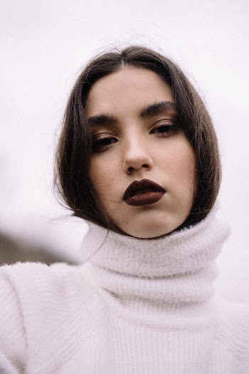 Woman Wearing White Turtleneck Sweater