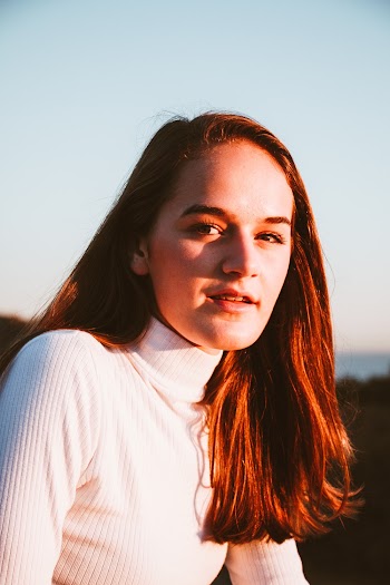 Woman Wearing White Turtleneck Sweater