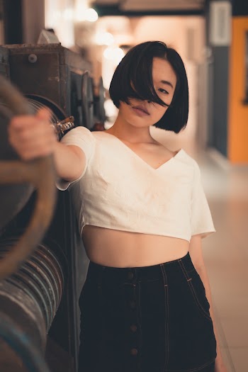 Woman Wearing White V-neck Crop-top And Black Denim Skirt