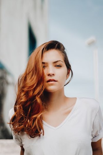 woman wearing white V-neck top
