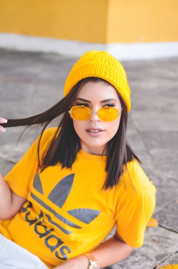 Woman Wearing Yellow Adidas Shirt