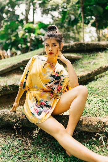 Woman Wearing Yellow and Black Floral Dress