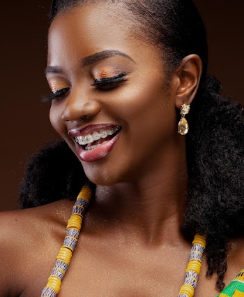 Woman Wearing Yellow and Grey Beaded Accessory