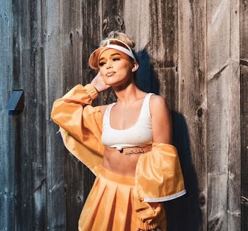 Woman Wearing Yellow and White Top and Bottoms