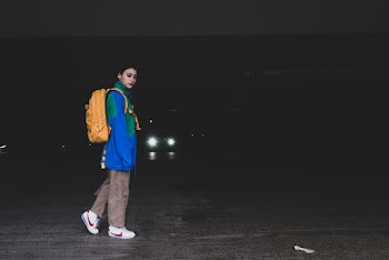 Woman Wearing Yellow Backpack