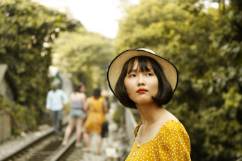 Woman Wearing Yellow Dress and Hat