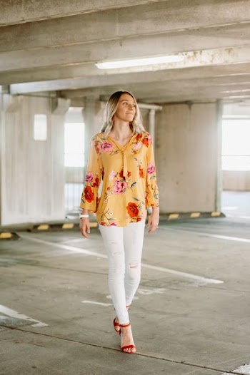 woman wearing yellow, green, red, and pink floral long-sleeved shirt