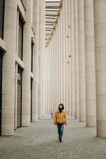 Woman Wearing Yellow Jacket and Blue Denim Jeans