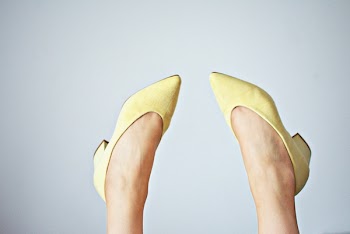 Woman Wearing Yellow Pointed-toe Pumps 