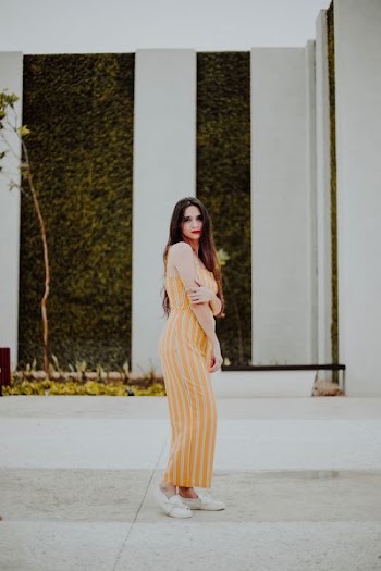 woman wearing yellow striped dress