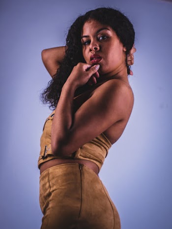 Woman Wearing Yellow Suede Crop Top And Bottoms