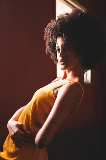 Woman Wearing Yellow Tank Top Bending Back