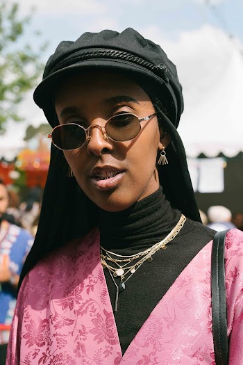 Woman Wears Black Fitted Cap