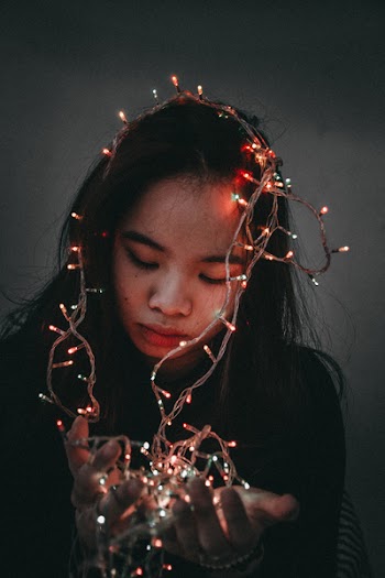 Woman Wears Black Long-sleeved Shirt Hold String Lights