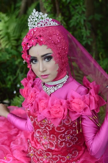 Woman Wears Pink Long-sleeved Dress With Crown