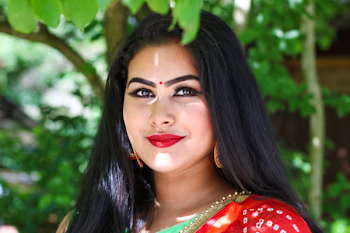 Woman Wears Red Top Under Green Tree at Daytime