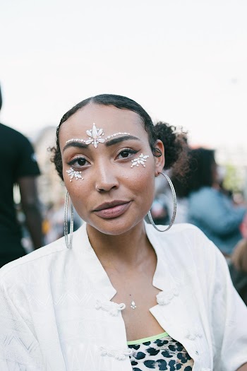 Woman Wears Silver-colored Hoop Earring