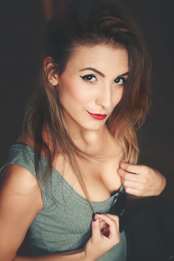 Woman With a Gray Scoop Neck Top