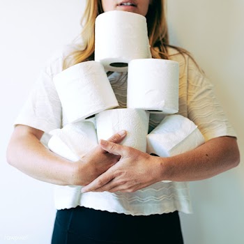 Woman with a pile of toilet tissue rolls | Free  photo - 2312903