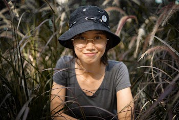 Woman With Black Bucket Cap