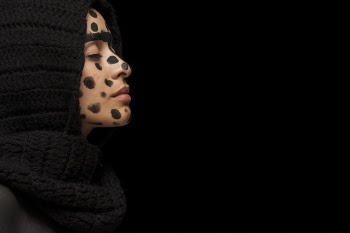 Woman With Black Dots on Face