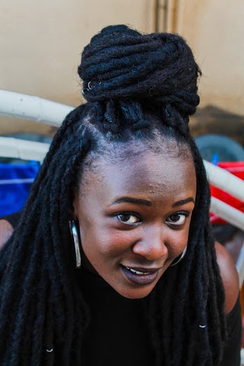 Woman With Black Long Braided Hair Smiling