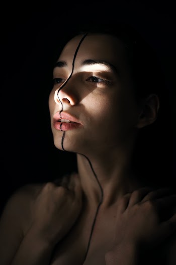 Woman With Black Mark in Between Face