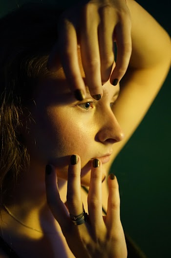 Woman With Black Nail Polish
