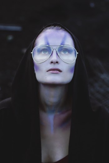 Woman With Black Pullover Hoodie With Gold Aviator-style Eyeglasses