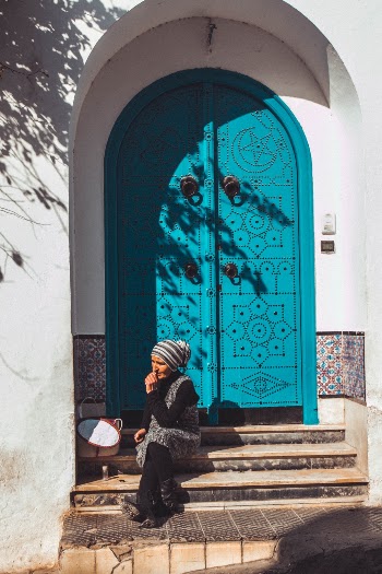 Woman with blue door