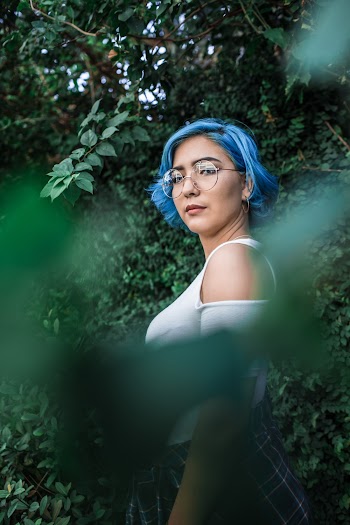 Woman With Blue Hair and White Cold-shoulder Top