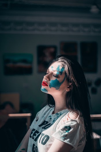 Woman With Blue Paint on Her Face